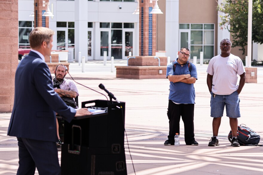 Albuquerque Mayor Tim Keller speaks on the importance of the youth shelter as a group of citizens look on