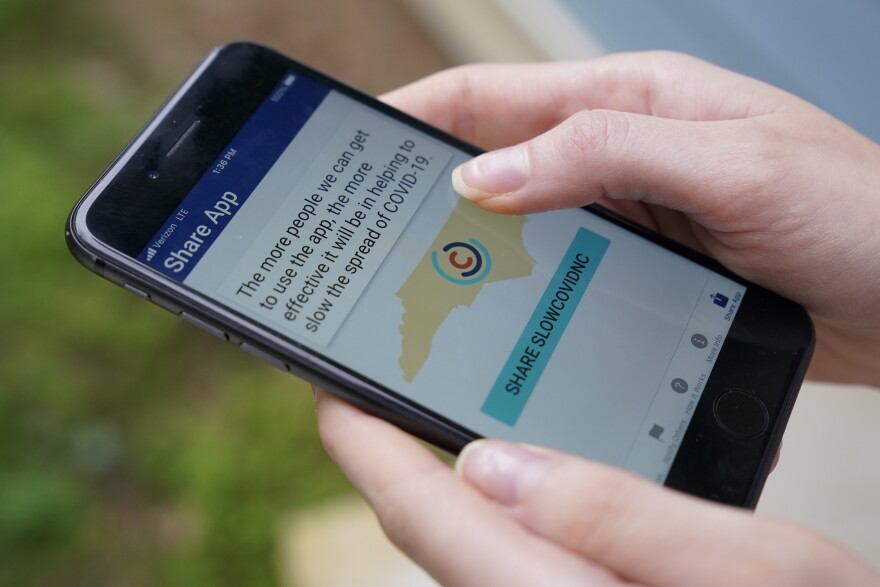 North Carolina's cell phone app contact tracing SlowCOVIDNC is shown on Friday, Dec. 4, 2020, in Charlotte, N.C. An analysis shows that few Americans are utilizing contact tracing technology launched in a host of U.S. states and territories.