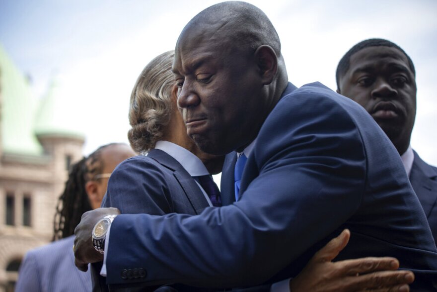 Attorney Ben Crump hugs Reverend Al Sharpton as he walks into the Hennepin County Government Center for the sentencing of former police officer Derek Chauvin on Friday, June 25, 2021 in Minneapolis.