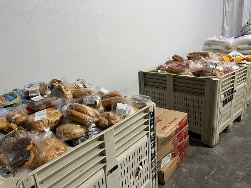 When His Compassion Food Bank does have food, containers brim with loaves of bread, muffins and desserts. Volunteers divided these into boxes for families in need Nov. 1. (Emma Behrmann/ WUFT News)