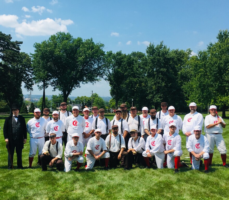 The Clodbusters and Red Stockings pose for a photo at 10 Wilmington Place, a senior center in Dayton, earlier this month. Vintage teams often play at senior centers, summer camps, benefits for military veterans, and community events. 