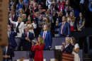 Texas Attorney General Ken Paxton, the state's GOP nominee for U.S. Senate, listens as President Donald Trump addresses the Republican midterm convention crowd in Dallas on Thursday, Sept. 10, 2026.