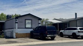 Multiple homes with cars parked outside