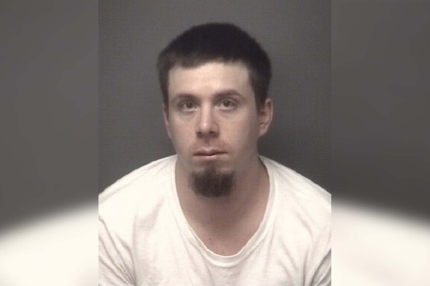 Travis Ryan Brown pictured in a mugshot released by the sheriff's department in 2022.