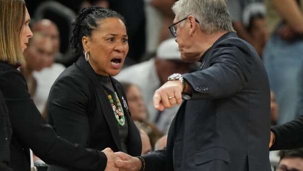 South Carolina head coach Dawn Staley, center, and UConn head coach Geno Auriemma argue after a woman's NCAA college basketball tournament semifinal game at the Final Four, Friday, April 3, 2026, in Phoenix. (AP Photo/Rick Scuteri)