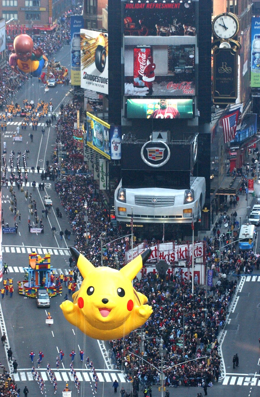 The Pikachu balloon floats down Broadway in Times Square during the Macy's Thanksgiving Day parade Thursday Nov. 27, 2003, in New York. 