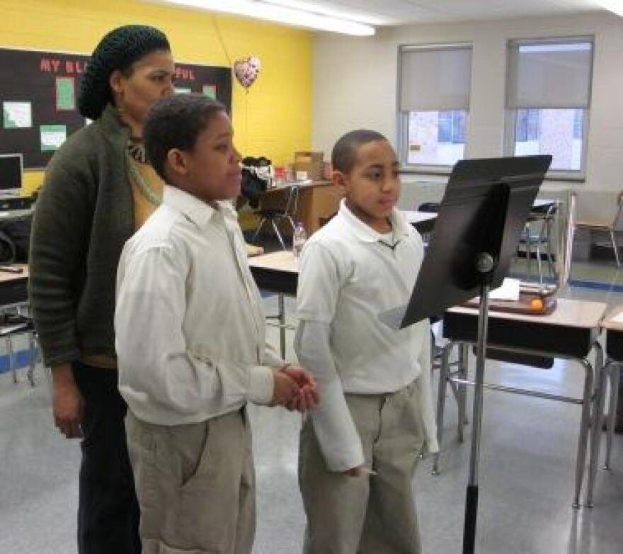 Teaching artist Annette Daniels-Taylor with school #39 students Josiah Mallory and Jordon Kerr