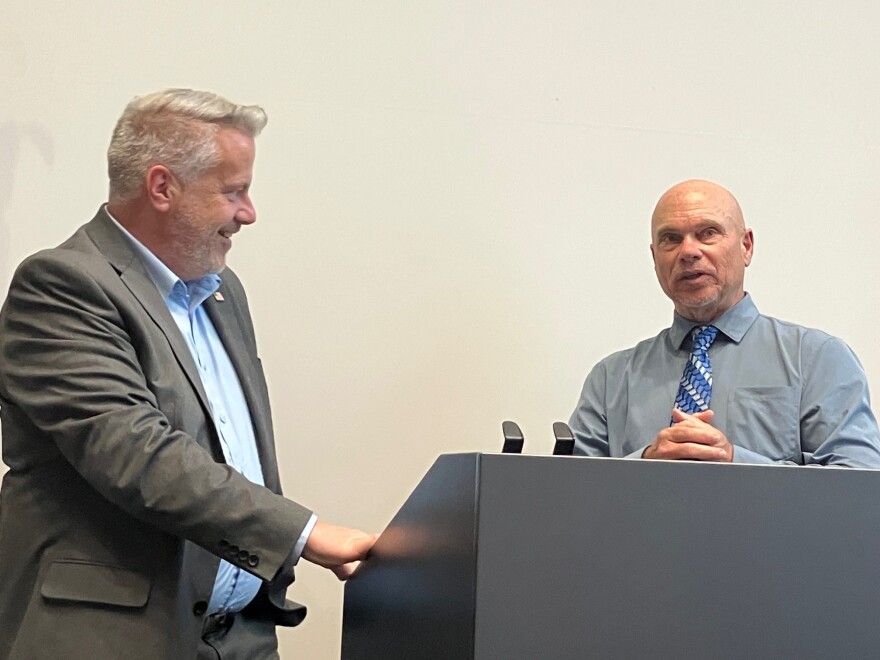 Silvis city administrator Jerry Leiboviz (right) speaks with U.S. Rep. Eric Sorensen (IL-17th) about needed water and sewer infrastructure repairs along 1st Avenue downtown, on Tuesday, Aug. 11, 2026.