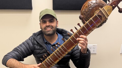 Musician Keshav Batish with his sitar in the KAZU studio