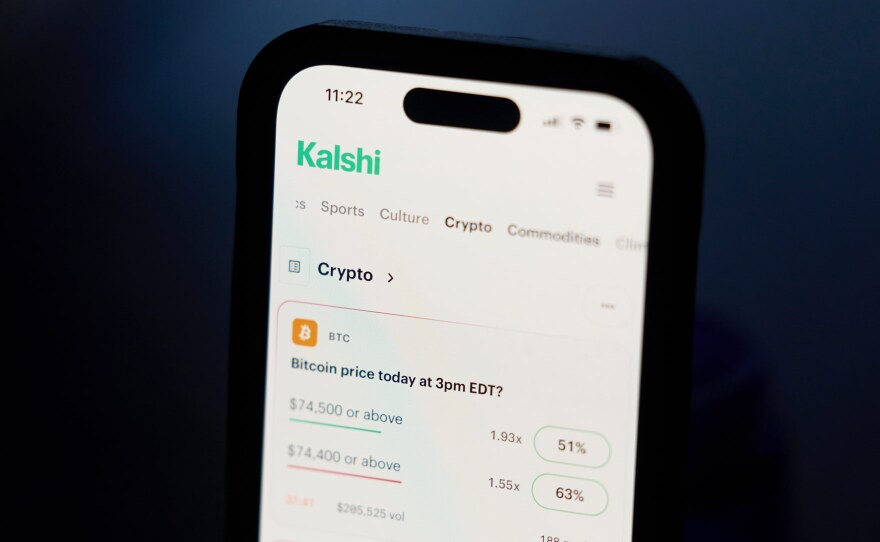 A phone displays crypto trades on Kalshi on Thursday, April 16, 2026, in Portland, Ore.
