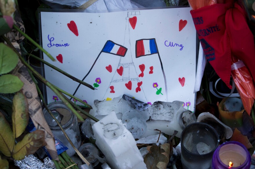 A child's drawing, featuring the Eiffel Tower and the French national flag, sits at a makeshift memorial in front of the Bataclan concert hall on Dec. 4.