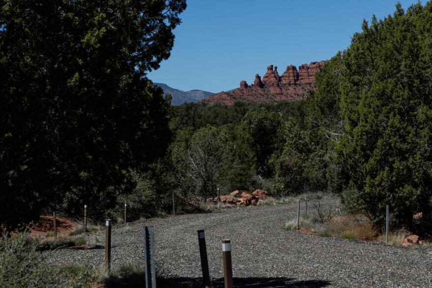 Sedona red rocks in the distance of road