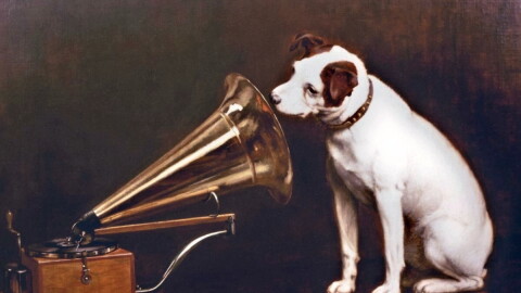 In England, artist Francis Barraud (1856-1924) painted his brother's dog Nipper listening to the horn of an early phonograph during the winter of 1898. Victor Talking Machine Company began using the symbol in their trademark, His Masters Voice, in 1900.