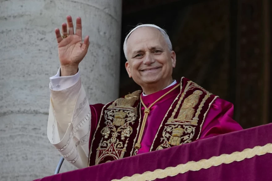 Pope Leo XIV waves to a crowd of faithful Sunday from the central loggia of the Papal Basilica of St. Mary Major in Rome, where he came to venerate the icon of the “Salus Populi Romani” (Protectress of the Roman People)