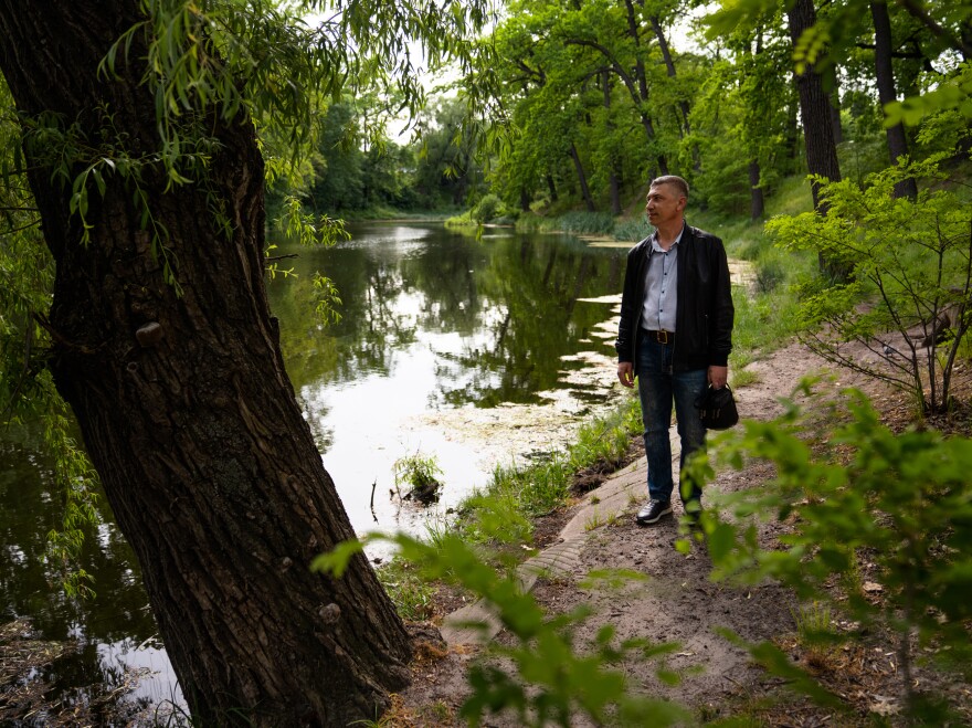 Roman German walks through a park in Kyiv, where he now lives. He was displaced from the occupied city of Enerhodar where he worked at the Zaporizhzhia Nuclear Power Plant.