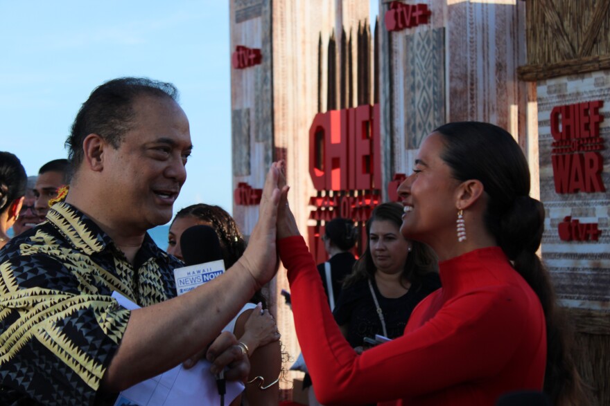 Hawaii New Now's Billy V giving Mainei Kinimaka a high five on the red carpet last night.