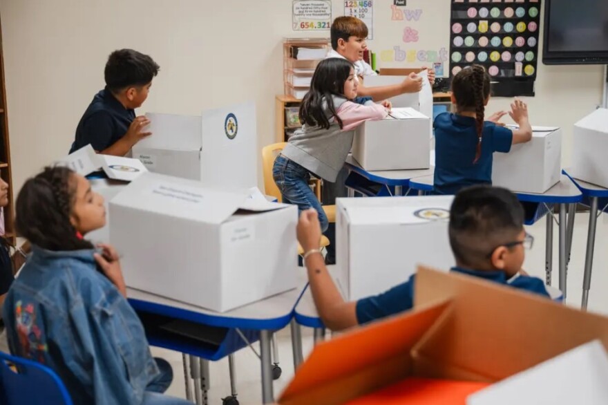 Students at Lorenzo G. Alarcon Elementary School this summer open boxes of school supplies paid for with Elementary and Secondary School Emergency Relief (ESSER) funds in San Elizario.
