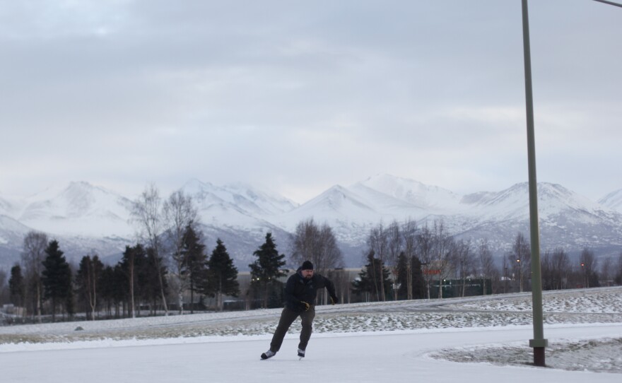 John Blees skates around a speedskating loop in Anchorage. Sports that require less snow, like ice skating and fat-tire bicycling, have become increasingly popular in the city as its climate changes.