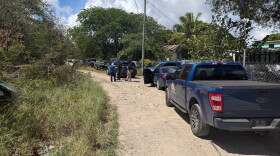 Pictured: VIPD personnel along a dirt road in the Old Fredensborg community on St. Croix, where authorities began their investigation into the fatal shooting of 24-year-old Jahmarie Warden on Tuesday, October 20, 2026.