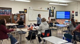Adults in the Spanish GED preparation program listen to their teacher during a class at Parkland High School in Winston-Salem at the end of May.