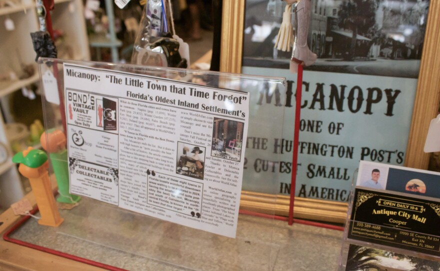 A vintage newspaper clipping celebrating Micanopy as “The Little Town that Time Forgot,” pointing to its growing reputation in travel media, even back in the age of newspapers.