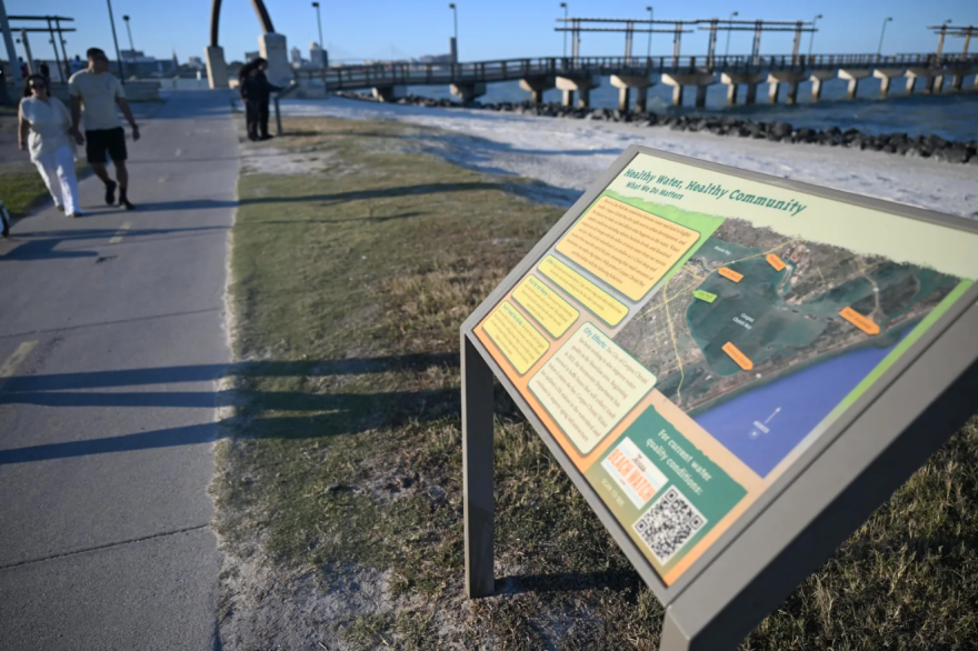A sign reading "Healthy Water, Healthy Community" sits next to a hike and bike path in Cole Park in Corpus Christi on March 19, 2026.