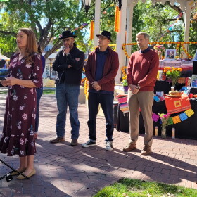 (From left to right) Rep. Melanie Stansbury, New Mexico House Speaker Javier Martínez, Albuquerque City Councilor Joaquin Baca, and Albuquerque Mayor Tim Keller stand in front of an ofrenda set up for the late activist Dolores Huerta in Old Town Albuquerque on Wednesday.