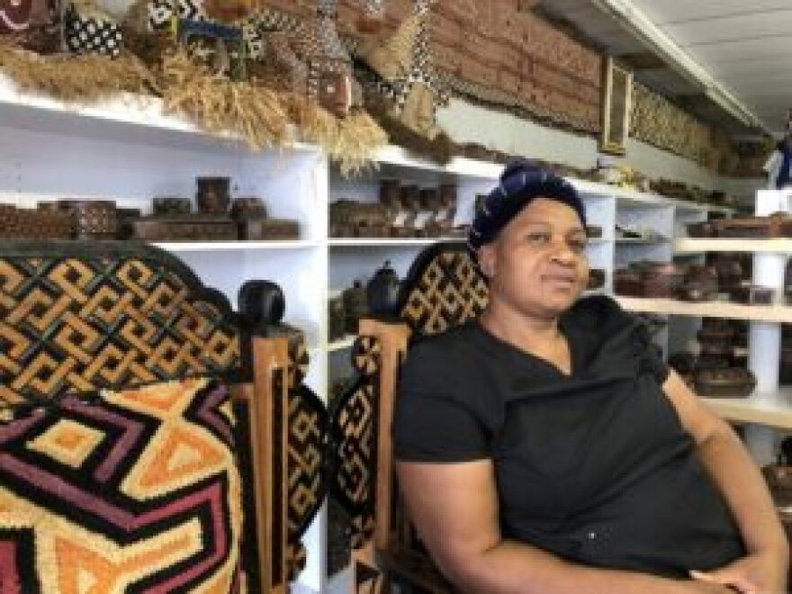 Petronille Kabanga, a Phoenix resident, poses for a photo inside her store selling handmade crafts and decorations in north Phoenix on Friday, June 18, 2021. Kabanga fled Congo in 2003 and is one of the thousands of refugees who now call Arizona home. Photo by Laura Gómez | Arizona Mirror