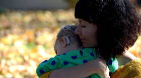 WHEAT RIDGE, CO - OCTOBER 31: Megan Nix share a quiet moment with her daughter Anna Wiedel (16 months) at their home October 313, 2016 in Wheat Ridge. Anna has CMV, a virus contracted in utero that caused her to be born deaf. Nix is writing about how CMV is more prevalent than anyone knows, and how doctors are not warning pregnant mothers. (Photo By John Leyba/The Denver Post via Getty Images)