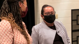 Lashonna Harden, a member of Unit 5's district equity leadership team, speaks with consultant Ivette Dubiel, of Systemic Educational Equity, during a break at the Unit 5 school board meeting Wednesday, Aug. 11, 2021, at Normal Community West High School.