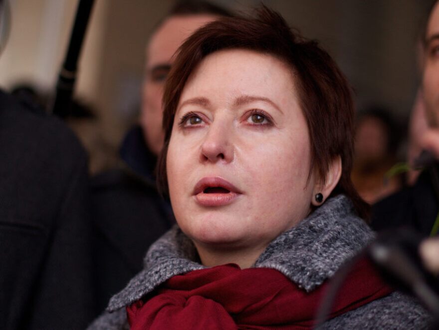 Kozlov's wife, Olga Romanova (shown here during his trial March 15), is a Russian journalist and opposition activist.