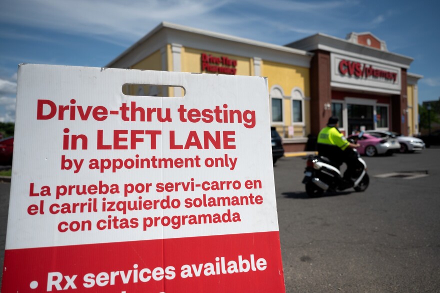 A sign for coronavirus testing outside of a CVS drive-through in Hartford, Conn.