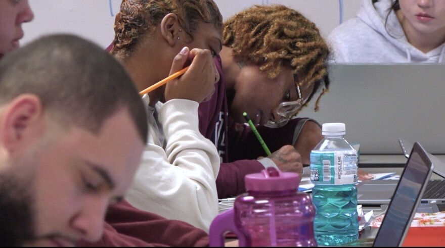 Cierra Westmoreland taking notes in one of her classes. 