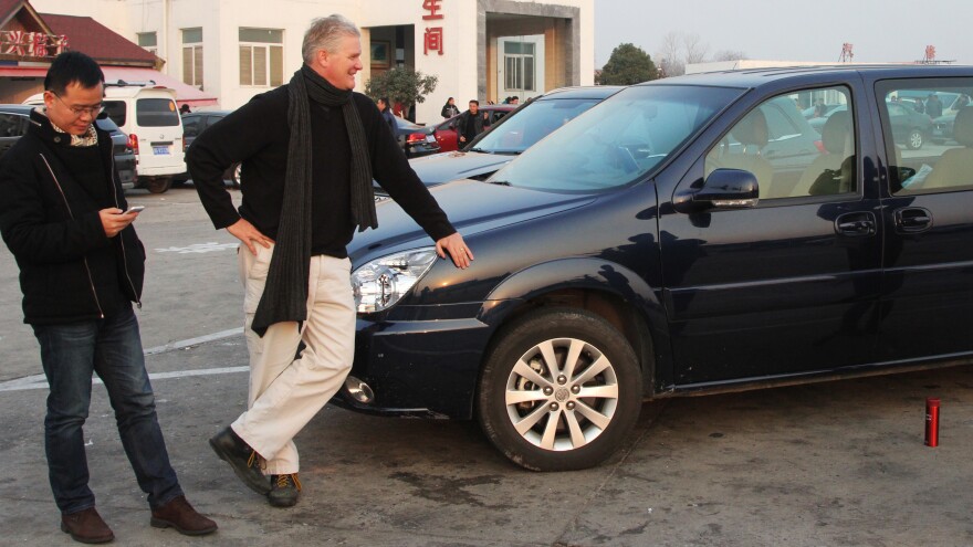 NPR's Frank Langfitt has been offering free taxi rides around Shanghai to talk to ordinary Chinese. He drives a Camry around the city, but rented a van for a trip 500 miles outside the city earlier this year. He recently decided to buy a car, which can be a complicated process in China.