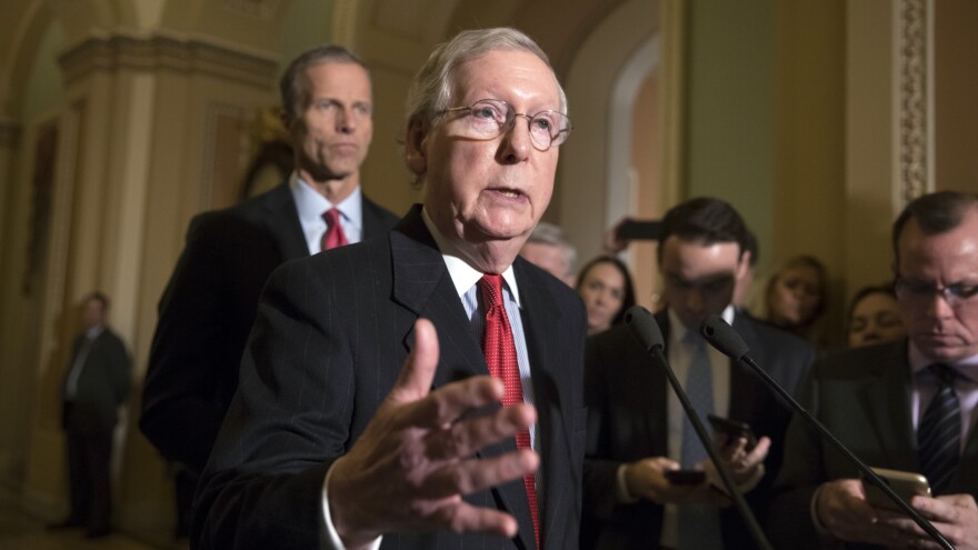 Senate Majority Leader Mitch McConnell, R-Ky., and Sen. John Thune, R-S.D., at a news conference on Tuesday where they announced that the individual mandate to have health insurance would be repealed in the Senate GOP tax bill.