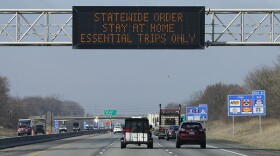 A highway sign in Carmel urges resident to stay home as the state ordered residents to remain at home except for essential activities to slow the spread of COVID-19, Wednesday, March 25, 2020.