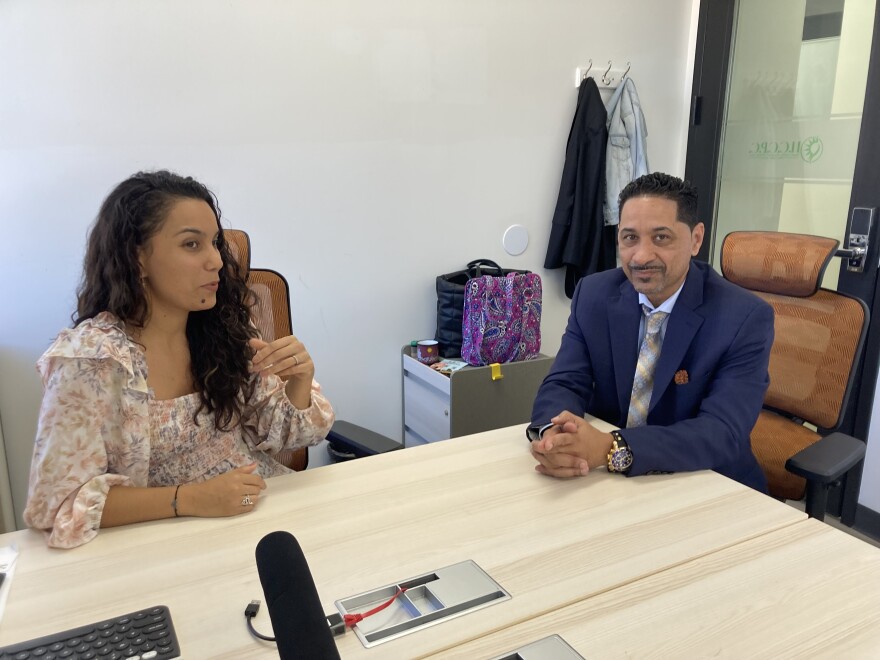 Paula Lacey (l) and Eli Gonzalez talking with Florida Matters at the Hispanic Chamber of Commerce of Pinellas County's office in downtown St. Petersburg.