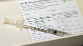 A syringe contains a dose of a Pfizer-BioNtech COVID-19 vaccine on Wednesday, Dec. 16, 2020 during a vaccine clinic at Providence Alaska Medical Center in Anchorage. 