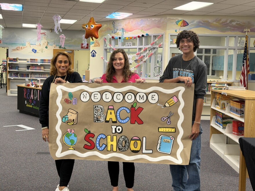 School board member Rebecca Thompson (middle) has been helping teachers and school staff prepare for the new school year and providing support for families affected by closures.