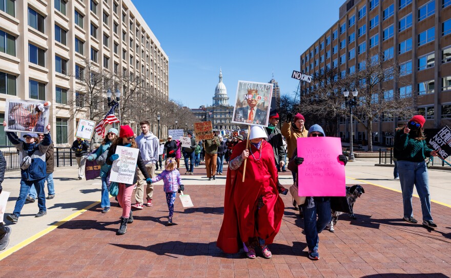 Thousands gathered at the Michigan Capitol in Lansing, Mich., on March 28, 2026, for a No Kings rally.