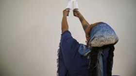 Crystal Kornickey holds up casts of her hands in a studio at the Gibbes Museum of Art in Charleston, S.C., on Thursday, Feb. 16, 2023. She is one of 36 people whose hands will be cast in bronze for a memorial to the likely enslaved people discovered in an unmarked burial ground. In recent decades, advances in DNA research have allowed scientists to use ancient remains and peer into the lives of long-dead people. In Charleston, that's meant tracing some of the African roots that were cut off by slavery. (AP Photo/Allen G. Breed)