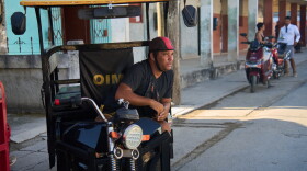 Liexer De La Cruz awaits customers in Campo Florido, Cuba's Havana province, Friday, Sept. 4, 2026. (AP Photo/Ramon Espinosa)