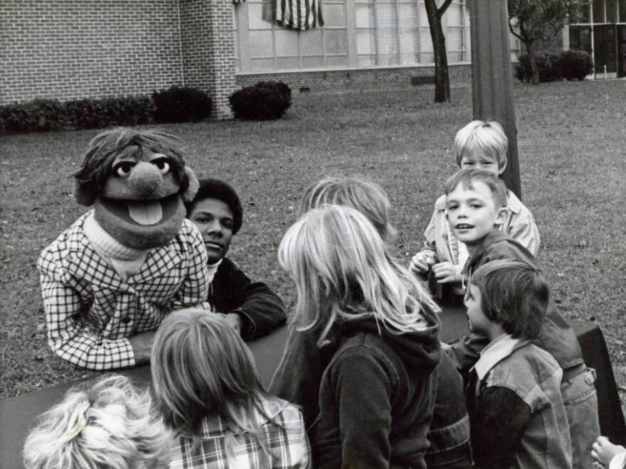 Kevin Clash (center) started making puppets when he was a teenager in Baltimore.