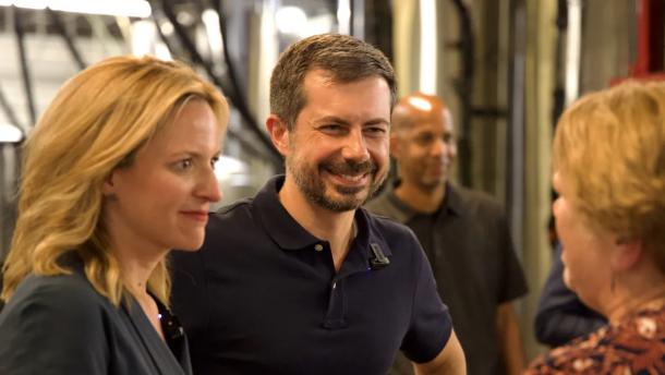 Jocelyn Benson and Pete Buttigieg talk to a voter at Right Brain Brewery in Traverse City on July 6, 2026. Buttigieg endorsed Benson in her bid for governor. (Photo: Simon D. Schuster/Bridge Michigan)