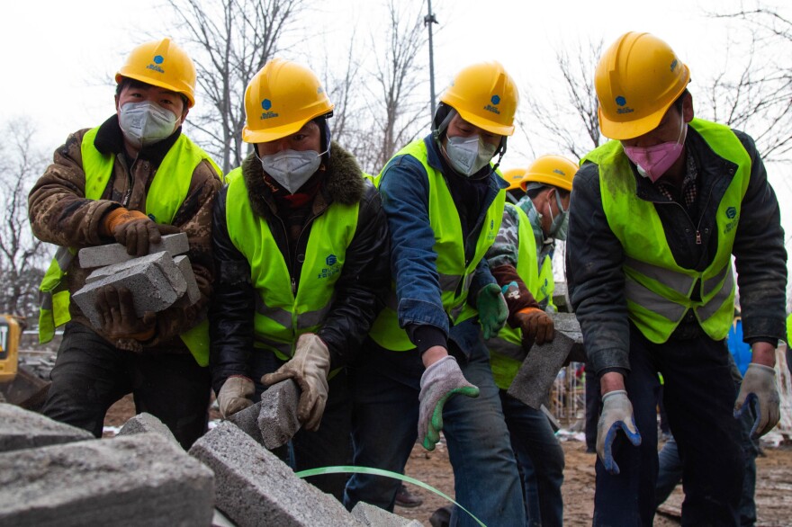 Construction workers were hastily assembled for the expansion of Beijing's Xiaotangshan Hospital.