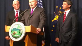 Jim Schellinger, center, was named the head of the Indiana Economic Development Corporation in 2015 by then-Gov. Mike Pence, left.