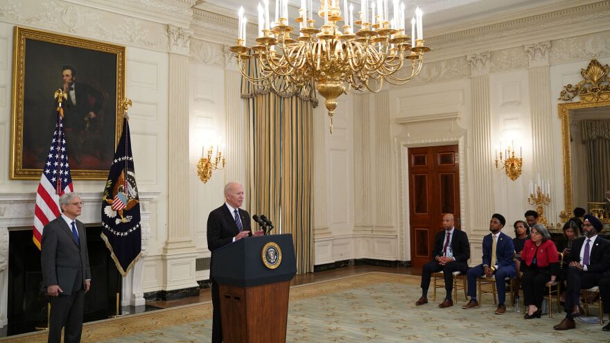 Attorney General Merrick Garland looks on as President Biden speaks about crime prevention Wednesday at the White House.