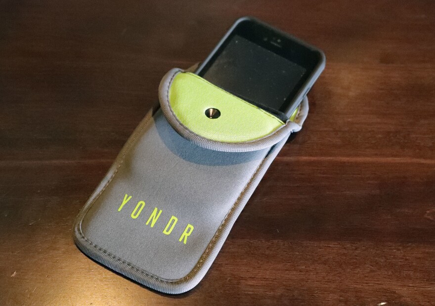 Alamance-Burlington School System is considering a contract with Yondr, a company that creates lockable pouches for students to put their phones away, but keep them on their person. JOHN RAOUX/AP