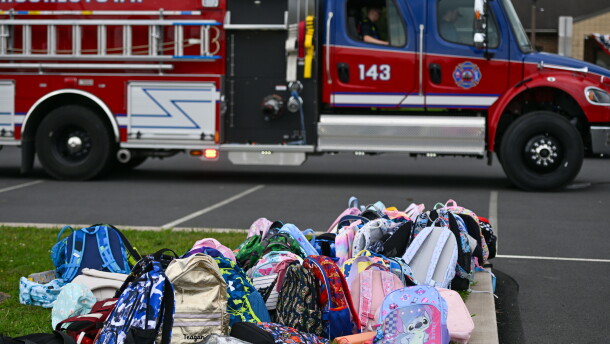 Childrens' bookbags sit outside of the Wyoming Area Catholic School after children were bused to Wyoming Area Secondary School following a fire at the Catholic school on Tuesday, Sept. 1, 2026.