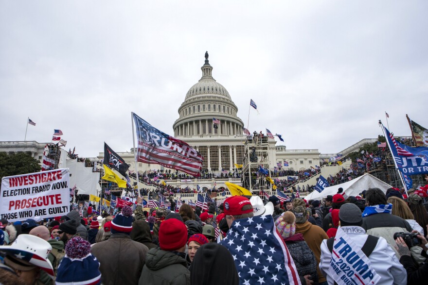 FILE - Insurrections loyal to President Donald Trump rally at the U.S. Capitol in Washington on Jan. 6, 2021. Paul Lovely, a former National Security Agency employee, has been sentenced to two weeks of imprisonment for storming the U.S. Capitol with associates described by authorities as fellow followers of a far-right extremist movement. (AP Photo/Jose Luis Magana, File)